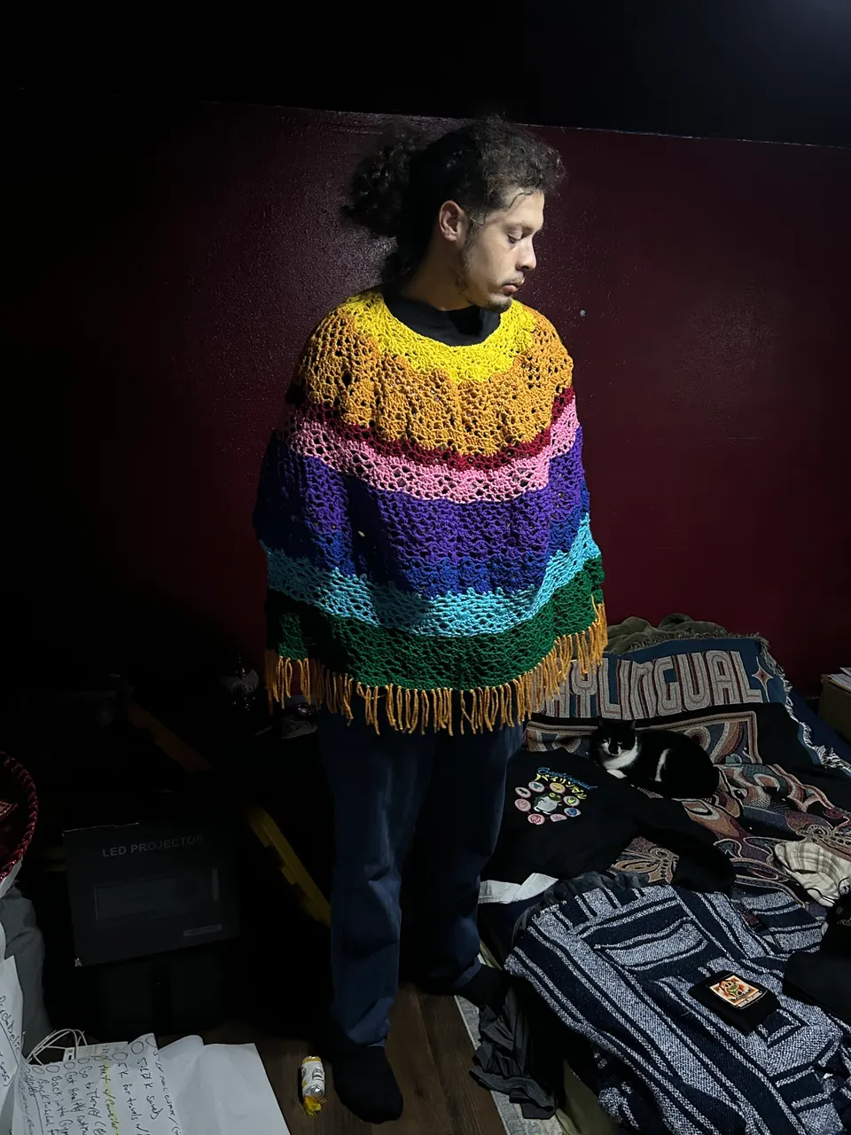 Dan Perales wearing a rainbow crochet poncho